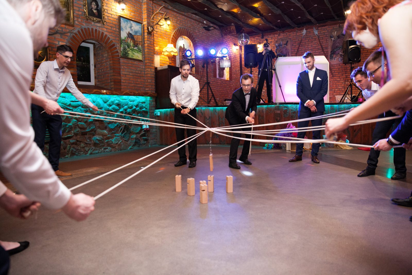 Wedding guests playing a party game on the dance floor