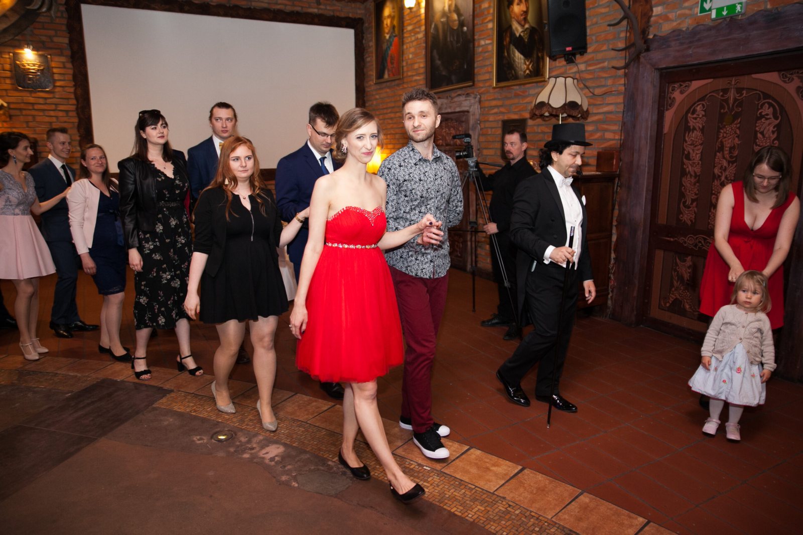 Wedding guests and MC leading a group activity